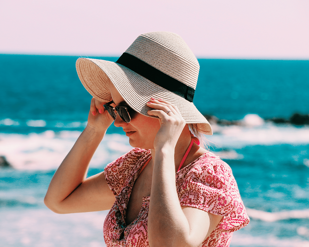 CellDerma Woman at Beach with Hat and Sunglasses Protection Content Image