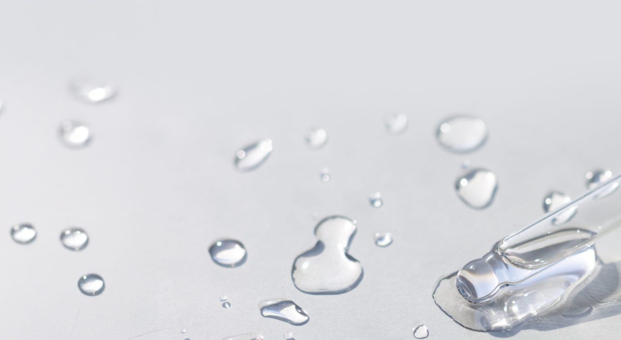 water serum pipette on grey surface