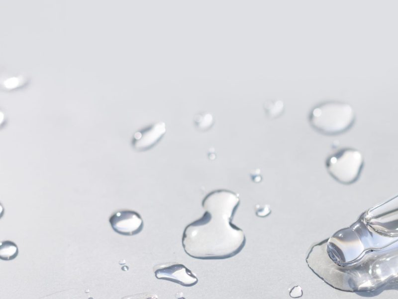 water serum pipette on grey surface